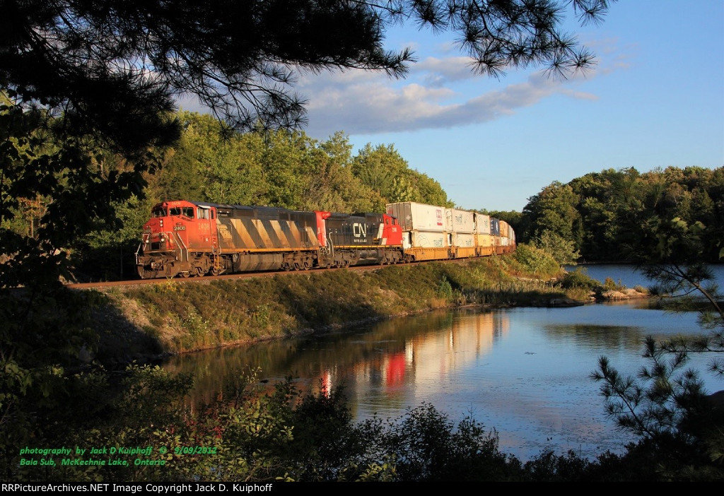 Canadian National, CN C40-8M 2408, leads a north bound 107 at, mp134.3, CNR  Bala sub, at McKechnie lake, Ontario. September 9, 2012. 